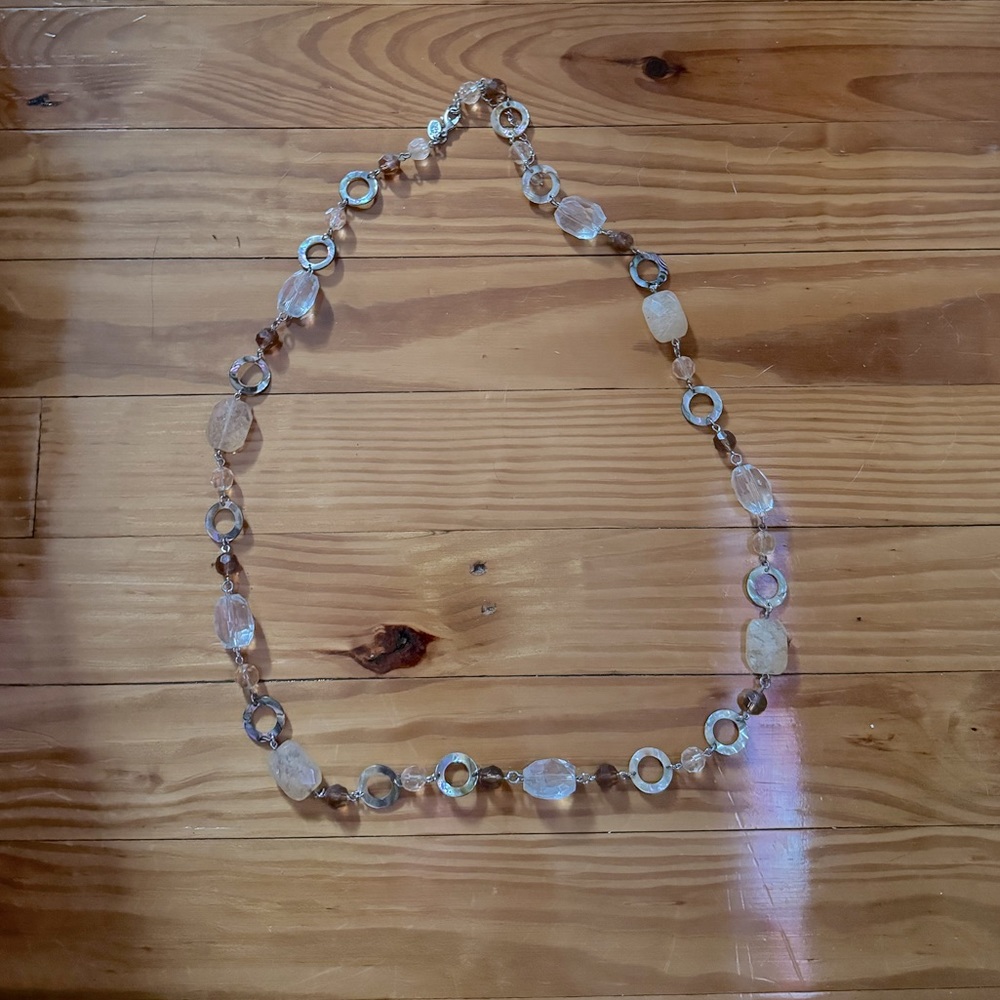 Clear, tan and light brown stones with silver accent.